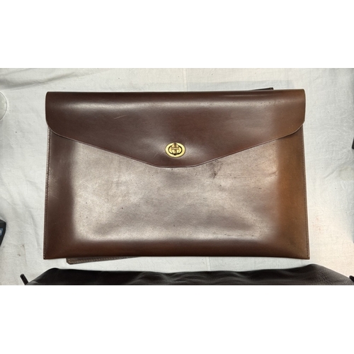 1108 - A Hidesign underarm briefcase and 2 other leather document holders