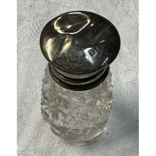 1149 - A glass match striker and small perfume bottle with silver tops