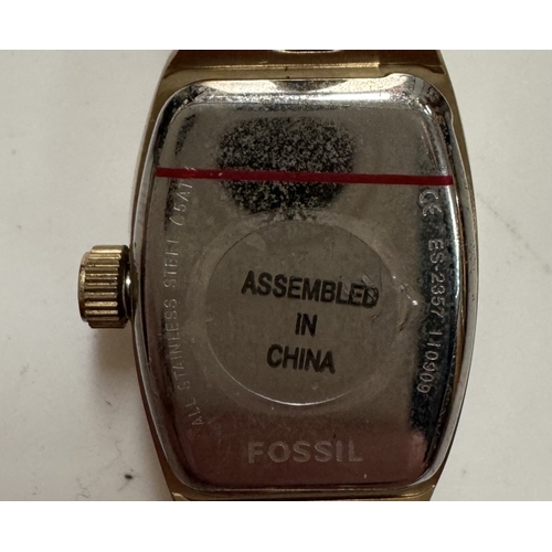 1161 - A ladies fossil wrist watch in tin