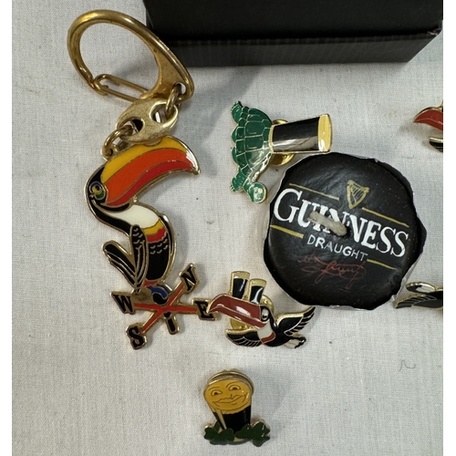 1162 - A quantity of Guinness collectors badges etc