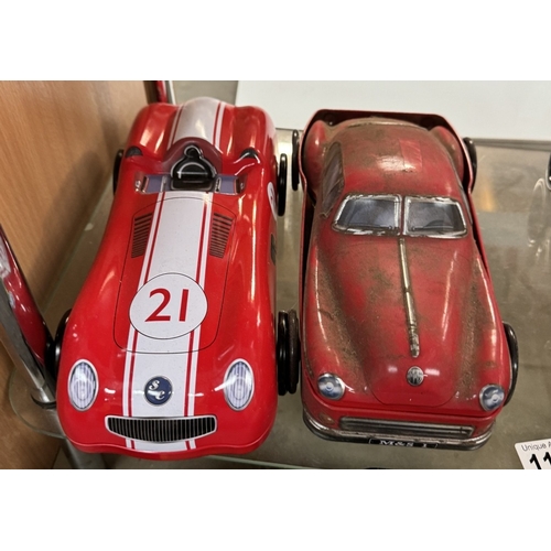 1168 - 6 Novelty biscuit tins in form of sports cars & trains