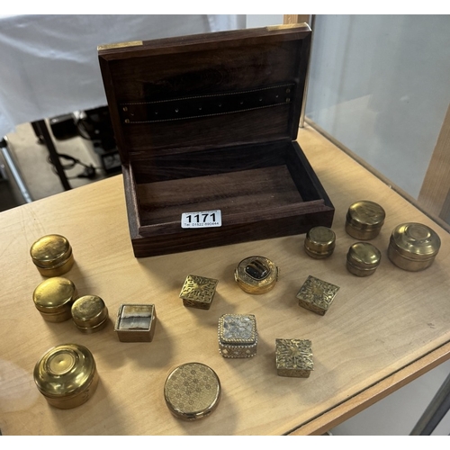 1171 - A quantity of small brass pill boxes and a brass bound wooden box