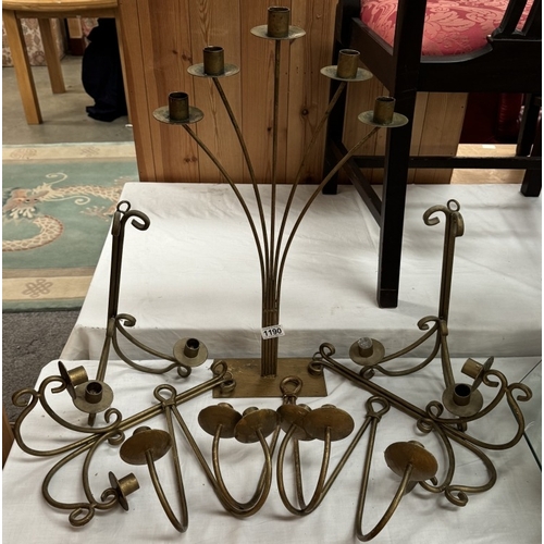 1190 - A quantity of wrought iron wall candle holders, mainly pairs