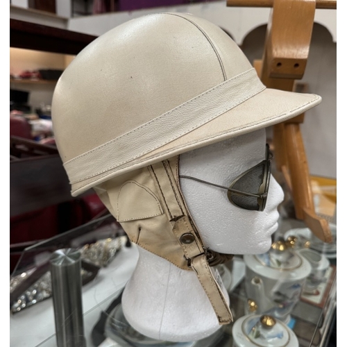 1202 - A vintage motorcycle corker helmet with goggles