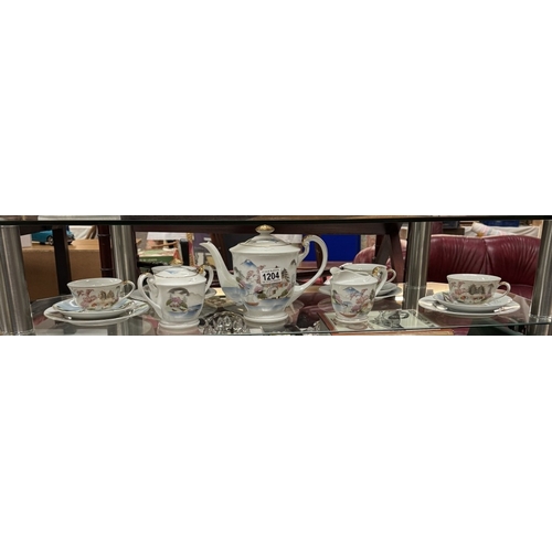 1204 - An 18 piece Japanese tea set (cups with Geisha features)