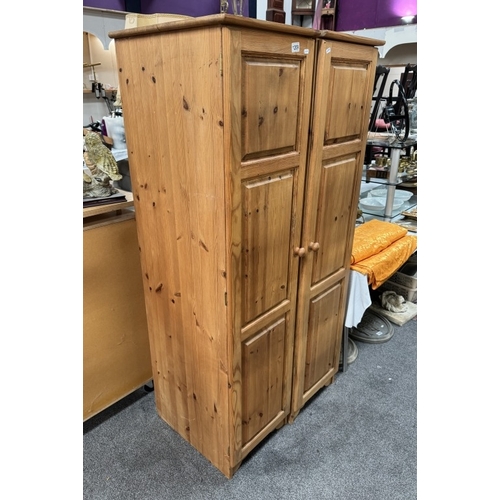 1209 - A pair of narrow solid pine wardrobes