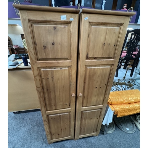 1209 - A pair of narrow solid pine wardrobes