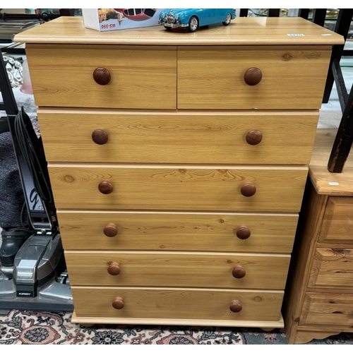 1215 - A pine effect chest of drawers