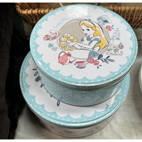 1100 - A quantity of Alice In Wonderland cake tins, Betterware Lazy Susan cake plate, glass jars etc