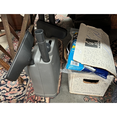 1218 - A Kirby 4 Tech Drive vacuum cleaner with attachments including carpet cleaner