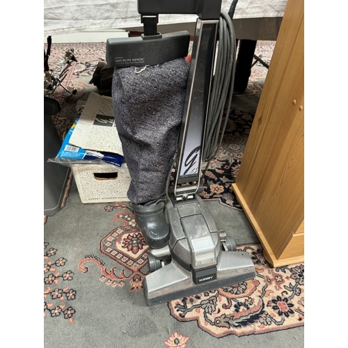 1218 - A Kirby 4 Tech Drive vacuum cleaner with attachments including carpet cleaner