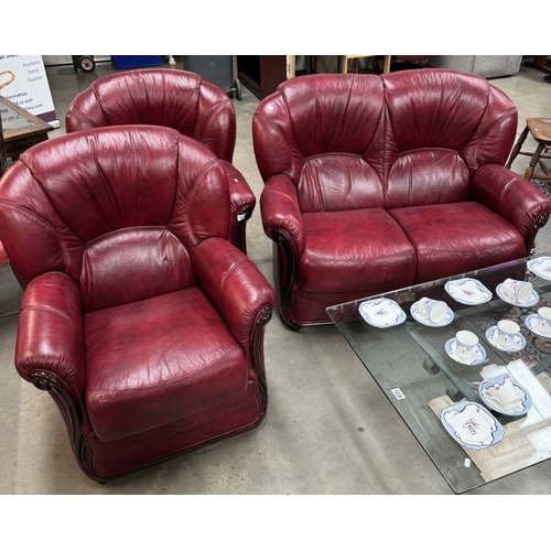 1233 - A deep red leather 2 seater settee 3 piece suite COLLECT ONLY