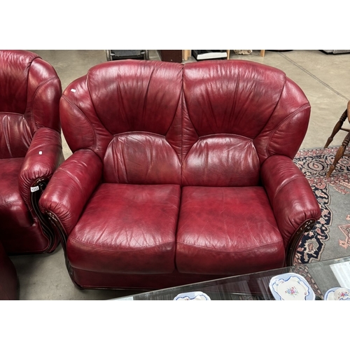 1233 - A deep red leather 2 seater settee 3 piece suite COLLECT ONLY