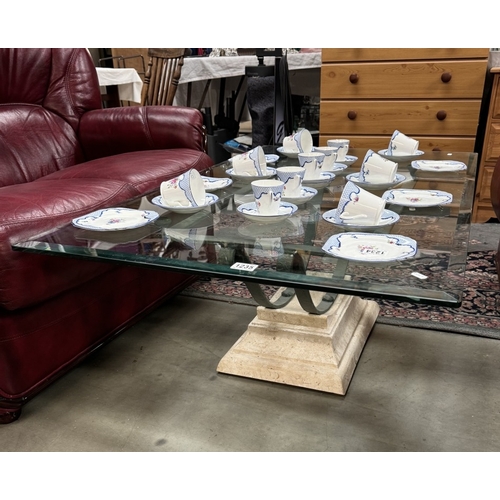 1235 - A glass top coffee table