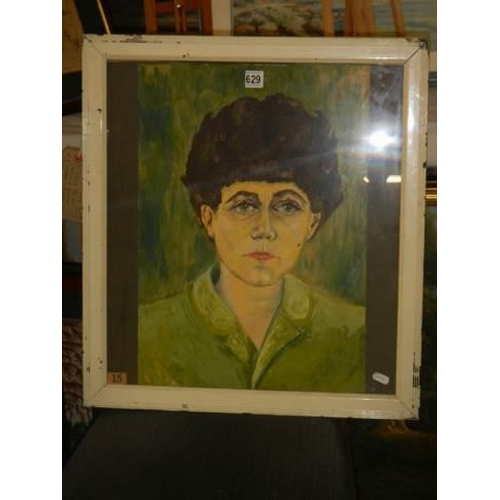 629 - A framed and glazed oil on paper painting of Woman in green top signed T Finch  COLLECT ONLY.