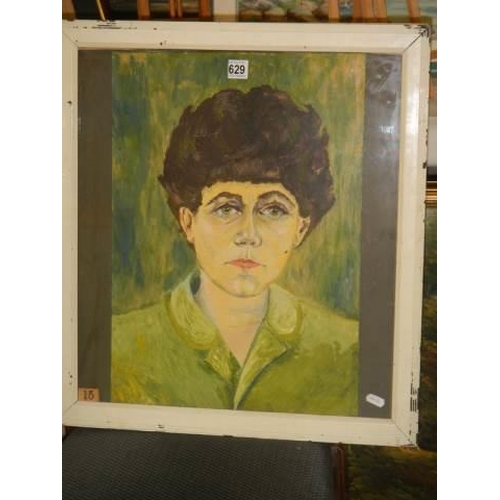 629 - A framed and glazed oil on paper painting of Woman in green top signed T Finch  COLLECT ONLY.