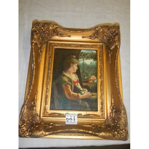 661 - A gilt framed over painted print of a young lady. 30 x 25 cm.