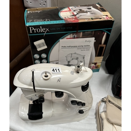 411 - A boxed Prolex 7stitch sewing machine