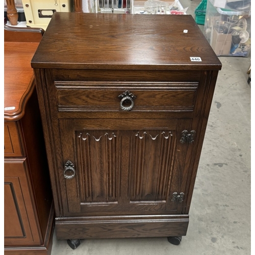 440 - An oak cabinet with linenfold door. COLLECT ONLY.