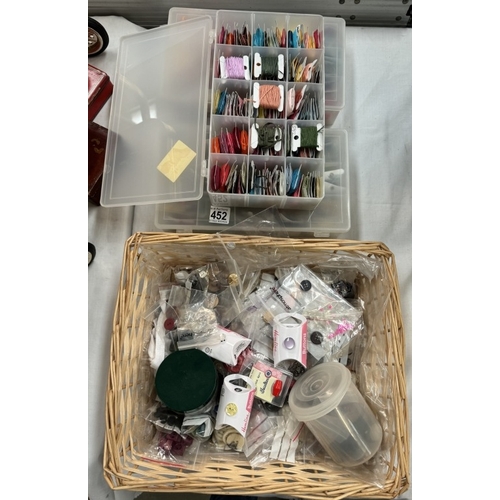 452 - A basket of buttons & A quantity of embroidery threads