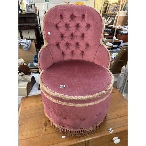 510 - A deep buttoned pink Draylon tub chair