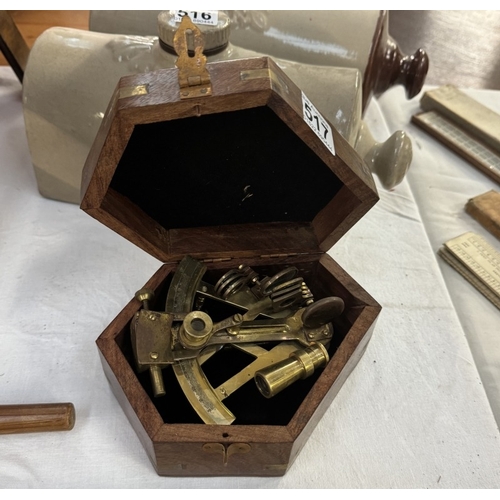 517 - A mini sextant in hard wood case