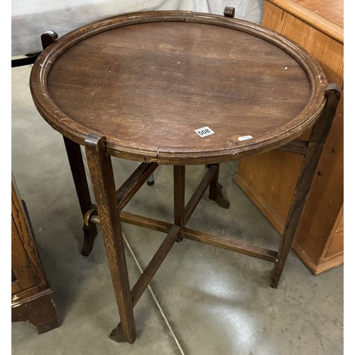 508 - A 1930s oak revertible folding card / tea table