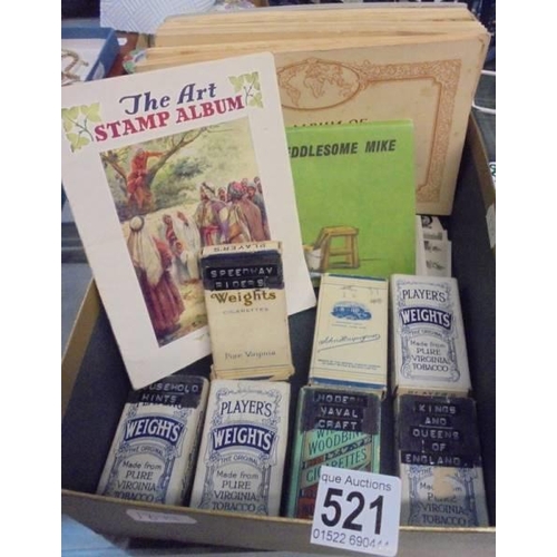 521 - A quantity of loose cigarette cards in leather case.