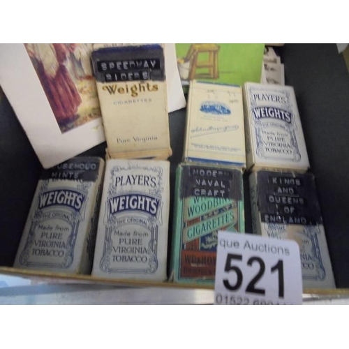 521 - A quantity of loose cigarette cards in leather case.