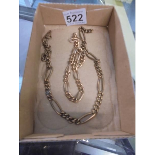 522 - Two yellow metal chains.