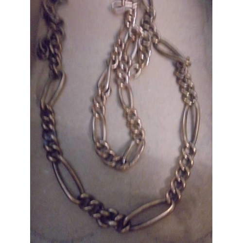 522 - Two yellow metal chains.