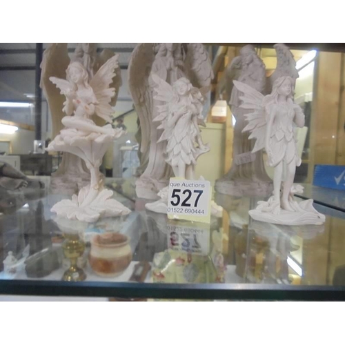 527 - A figure of Jesus, three angels and three fairies.