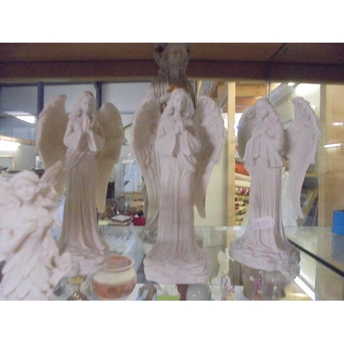 527 - A figure of Jesus, three angels and three fairies.