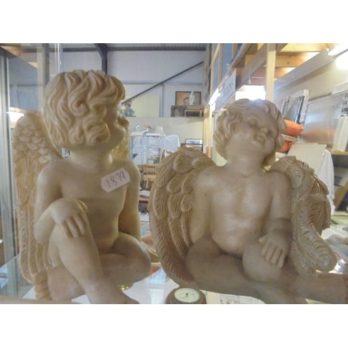 528 - Four assorted cherub figures.