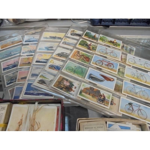 534 - A good lot of cigarette cards etc.,