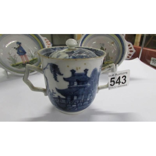 543 - An antique Chinese pattern blue and white chocolate cup with cover, a/f.