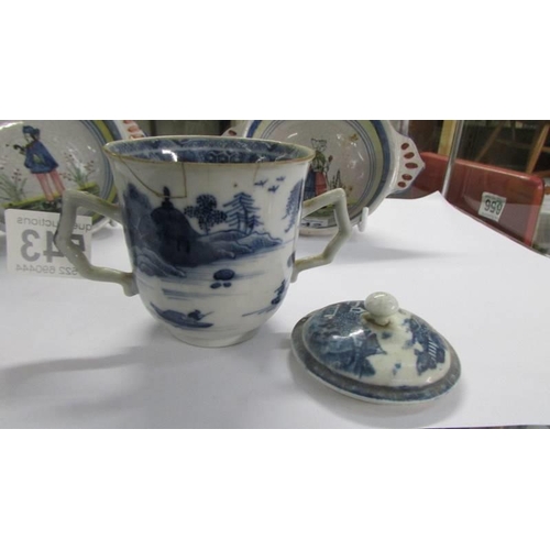 543 - An antique Chinese pattern blue and white chocolate cup with cover, a/f.