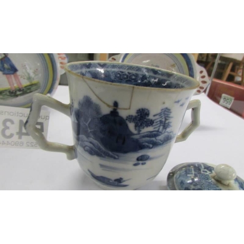 543 - An antique Chinese pattern blue and white chocolate cup with cover, a/f.