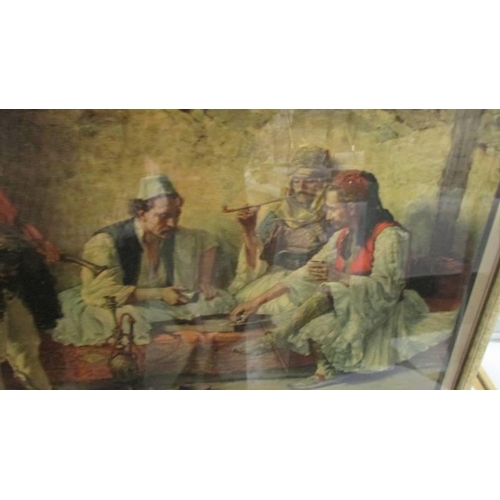 544 - A  framed and glazed lithograph featuring an Arabic scene signed P Ivanovitch. COLLECT ONLY.