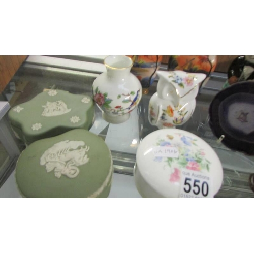 550 - A mixed lot including pair of Noritake vases, Wedgwood Jasper ware boxes, pill boxes, figures etc.,