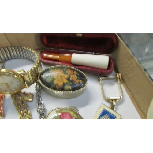 552 - A mixed lot including pill boxes, watches etc.,