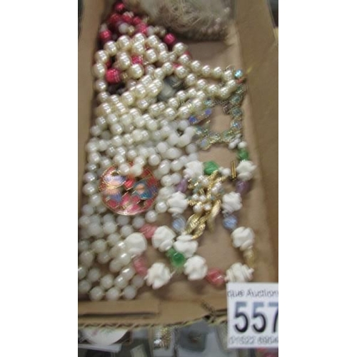 557 - A quantity of necklaces and loose beads.