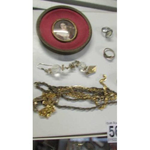 560 - Nine rings, other jewellery &  A modern framed miniature portrait.