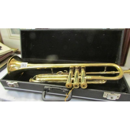 562 - A cased trumpet.