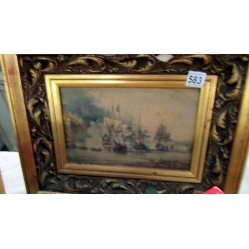 583 - A gilt framed sea battle scene.