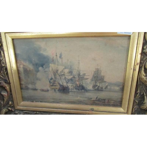 583 - A gilt framed sea battle scene.