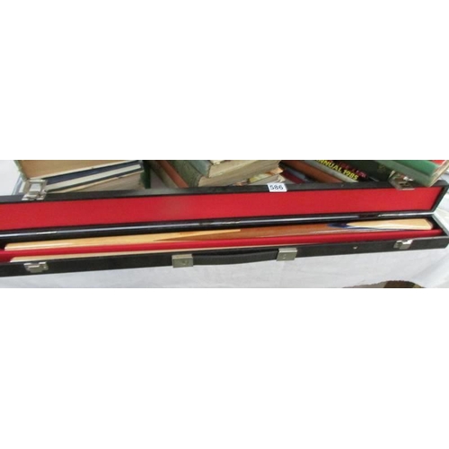 586 - A cased snooker cue.