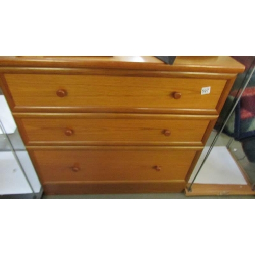 597 - A three drawer teak chest. COLLECT ONLY.