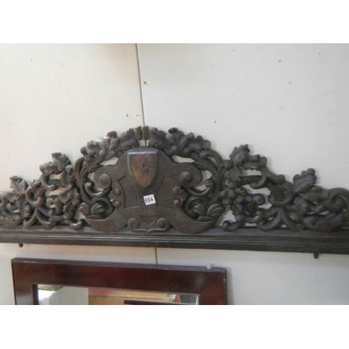 664 - A carved wood cabinet top.