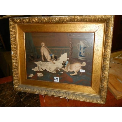 675 - A gilt framed late Victorian study of dogs shredding paper.